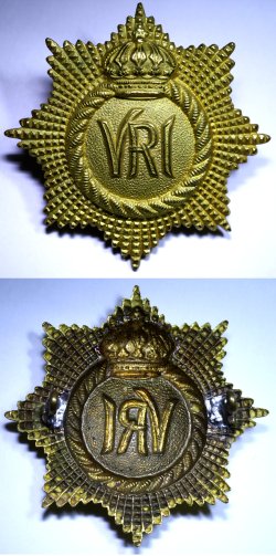 One-piece gilt Guelphic crown cap badge.