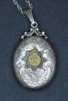 Silver locket with an 1927 pattern St Edward's Crown decoration.
