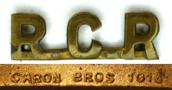 First World War period shoulder title with a single horizontal bar and angled ends on the letter 